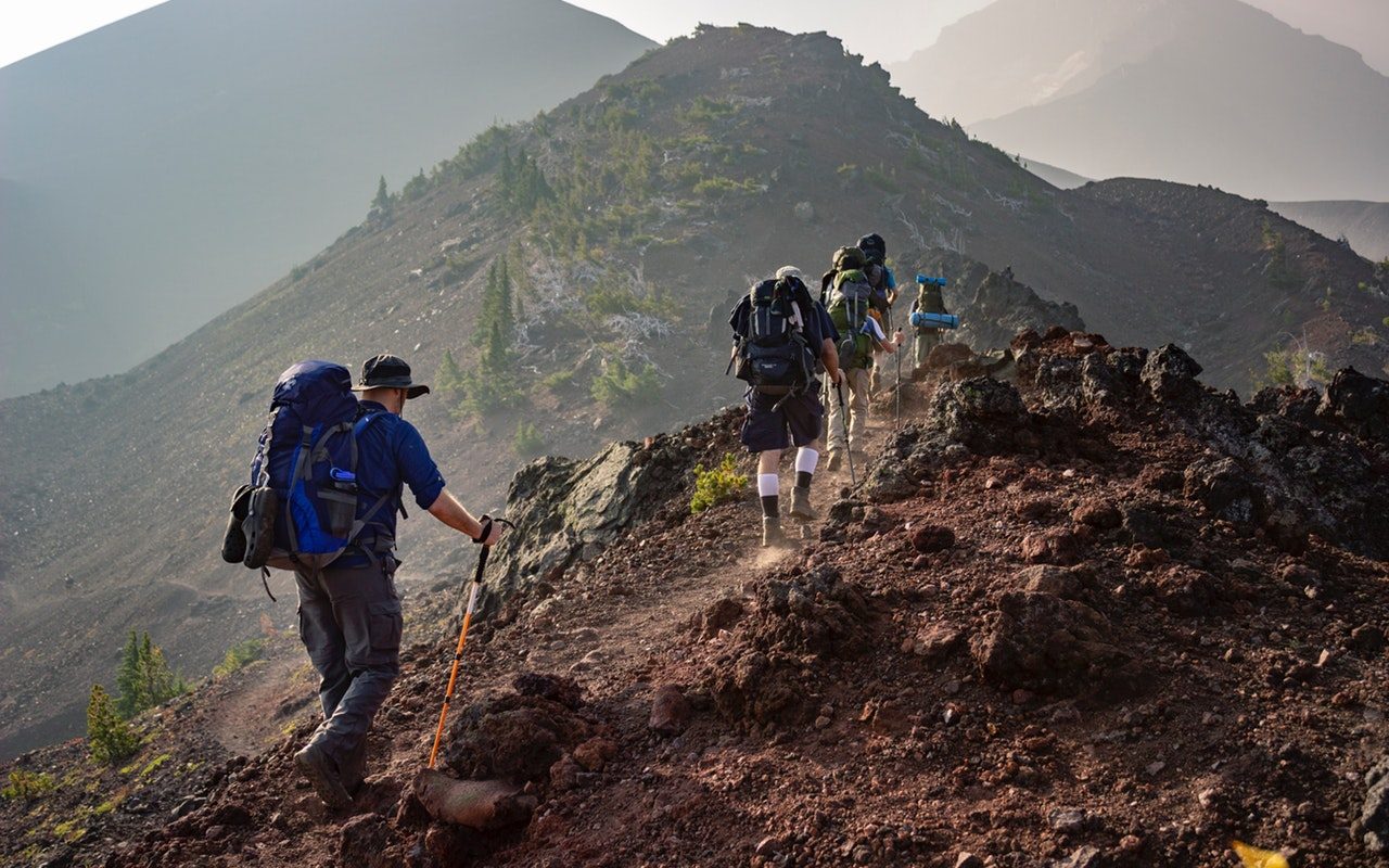 group-of-person-walking-in-mountain-1365425